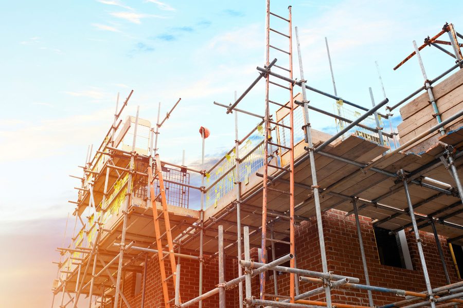 Scaffolding erected around houses in a new housing development